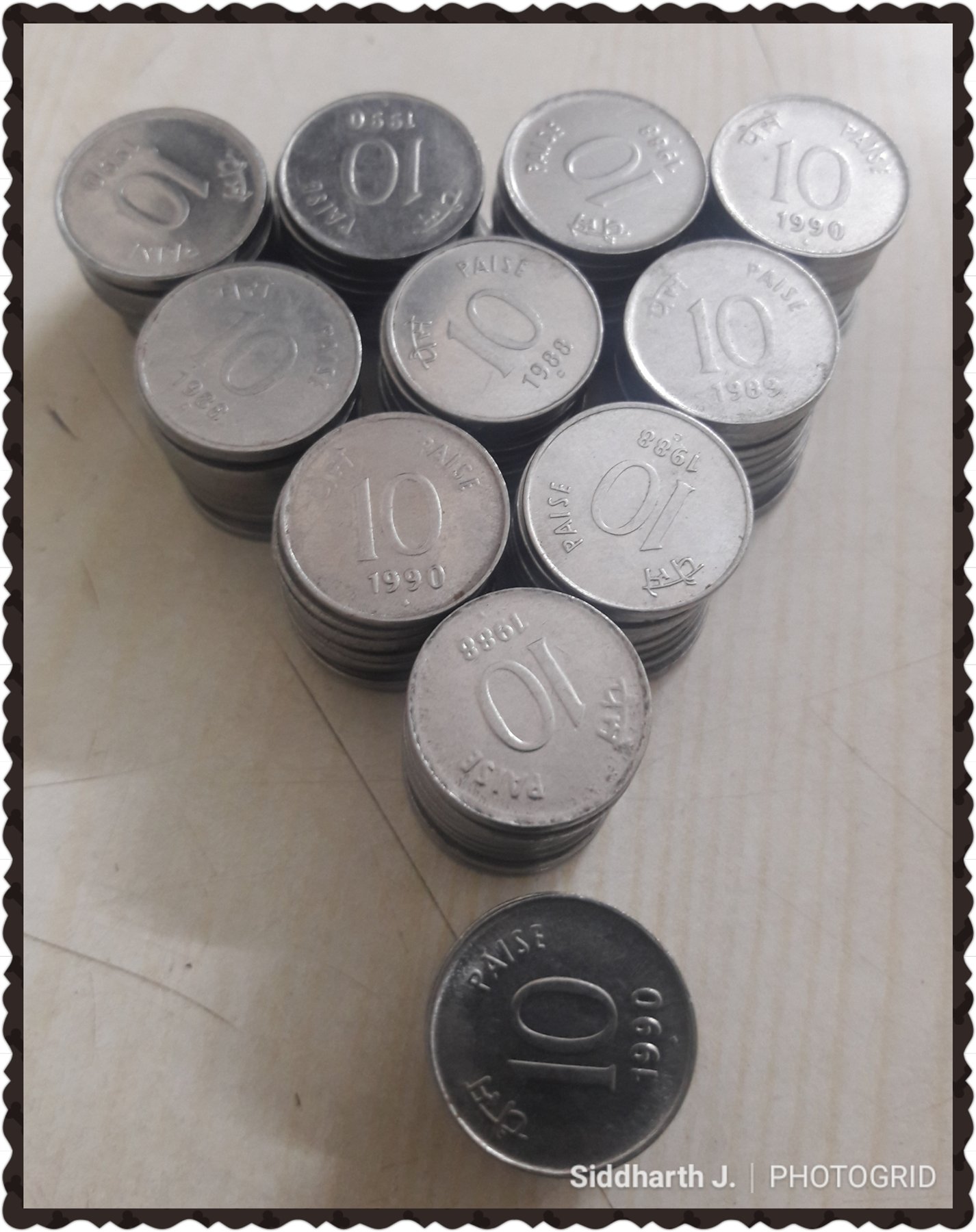 Stacks of Indian ten-paise coins from several years