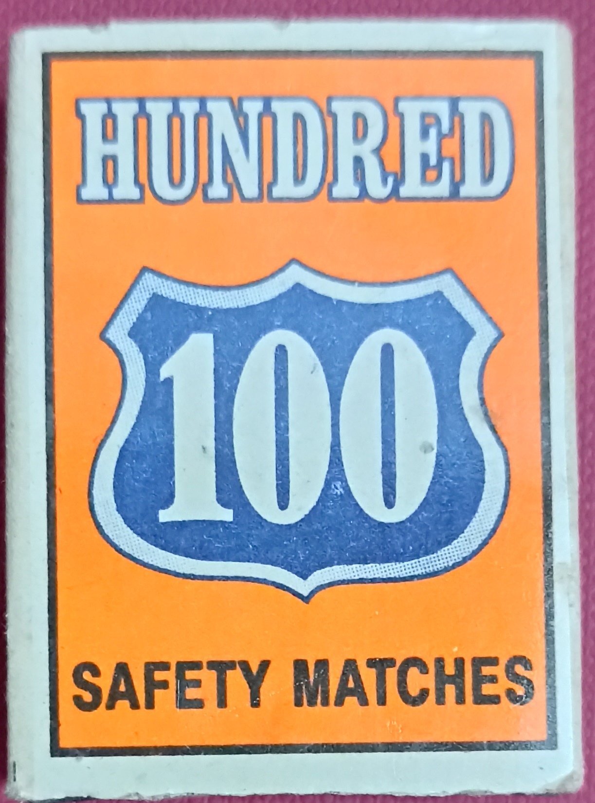 Hundred 100 safety matches label in orange, blue and white